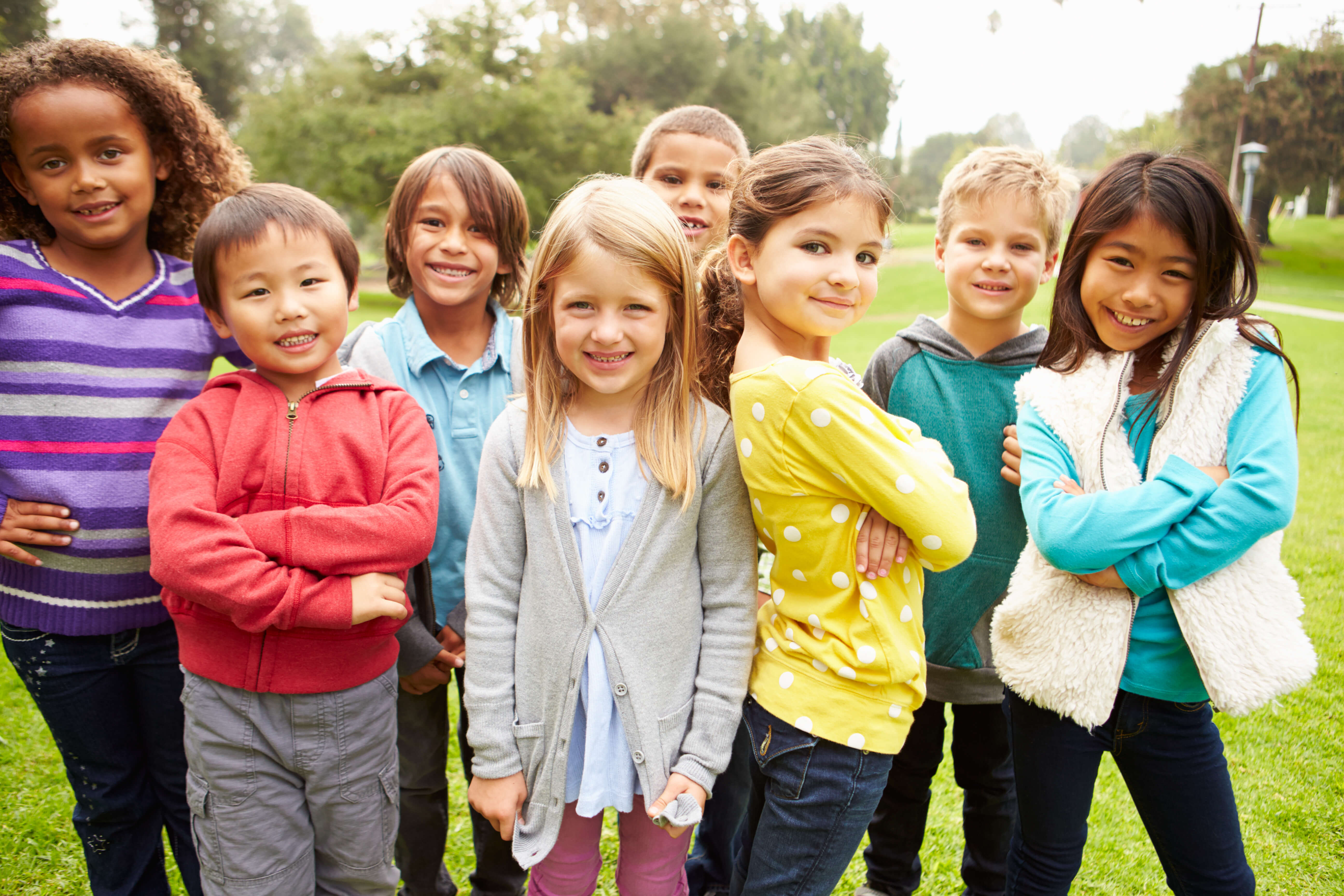 Group Of Young Children Hanging Out In Park - Health Powered Kids